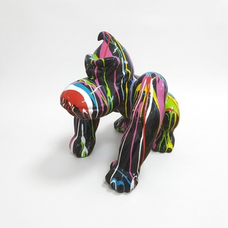 Abstract decorative sculpture designed as a gloss black colored cartoon gorilla in colorful stripes 70cm