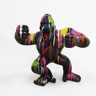 Decorative sculpture designed as a gloss full black colored shouting gorilla in colorful stripes120x40cm