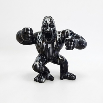 Decorative sculpture designed as a gloss full black colored shouting gorilla in white patterns 70x80x40cm