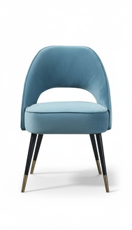 Modern upholstered chair with an elegant cutout in the backrest.