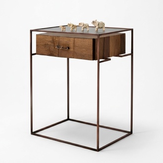Modern console table made of wood and glass with elegant lighting.