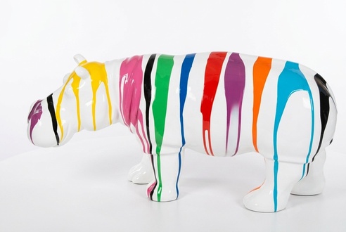 Decorative garden sculpture designed as gloss white colored hippo figure with colorful stripes