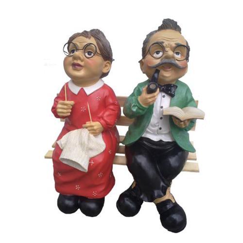 Colorful decor figure designed as adults on a wooden bench 40cm