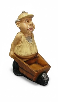 Decor figure of an adult dressed in beige cloth with a cigarette carrying a wheelbarrow 80cm