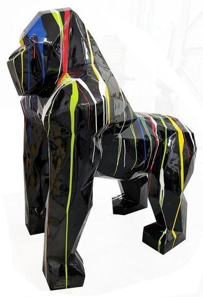 Abstract decorative sculpture designed as a gloss black colored geometric gorilla in colorful stripes 128cm