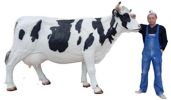 Decorative sculpture designed as a massive black/white cow figure 170 cm height